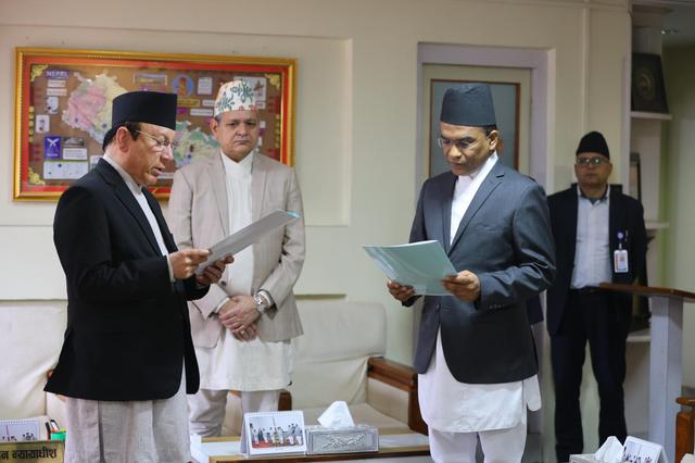Newly appointed Governor of Nepal Rastra Bank, Dr. Paudel, takes oath from the Chief Justice.